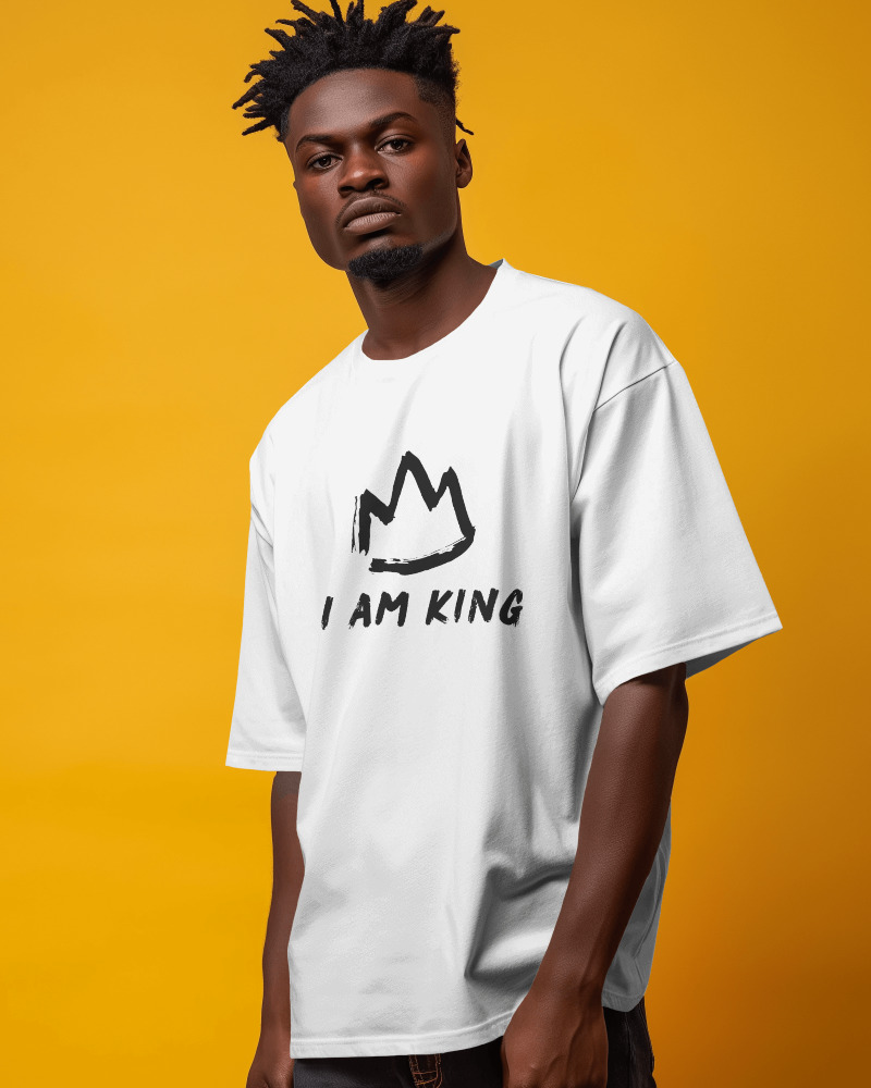 Model standing wearing I AM KING signature clothing line